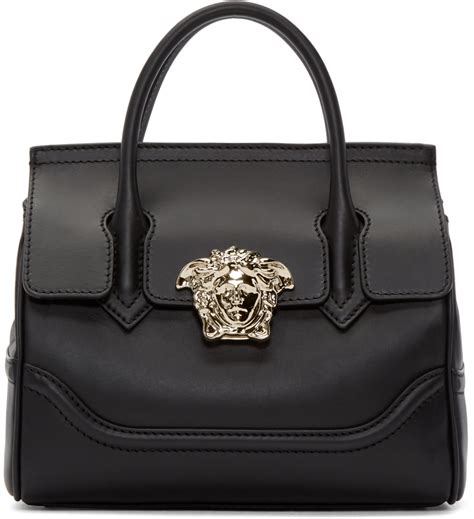 versace handgelenktasche mit gold|Versace black and white purses.